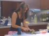 Diane Cutting something in kitchen